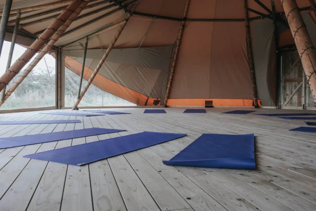 Empty yoga tipi with mats laid out ready for a Happy Kids Yoga class