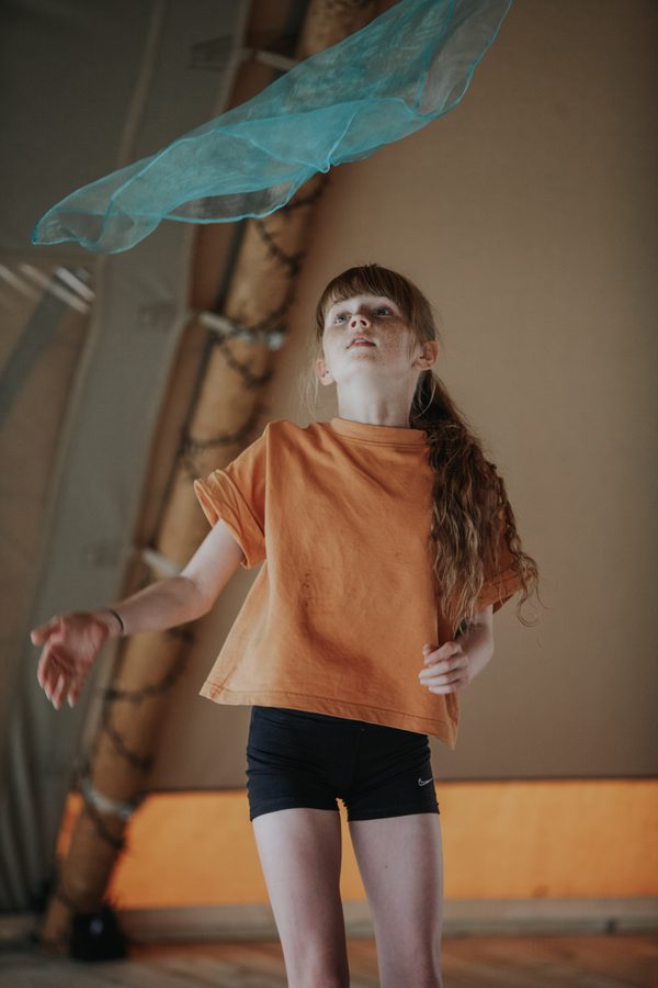 A girl dancing with a scarf